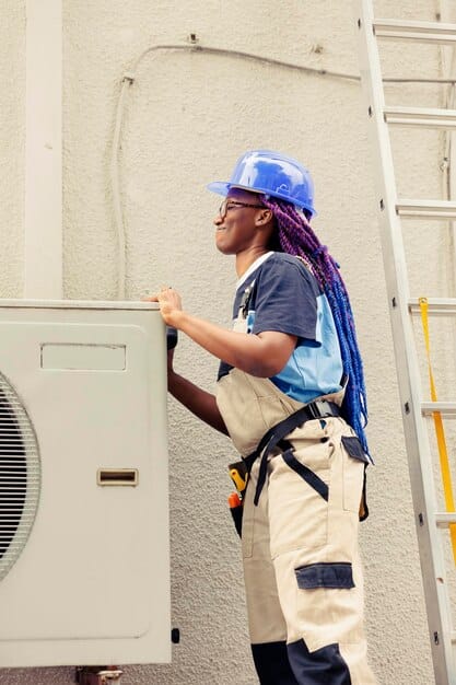 HVAC technician servicing an air conditioner — Second Act Trades