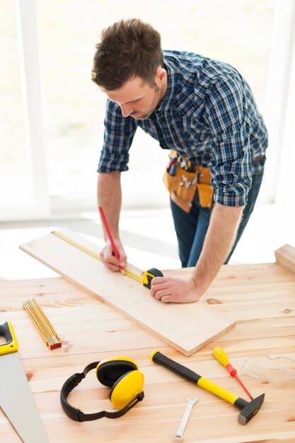 Carpenter measuring wooden planks — Second Act Trades