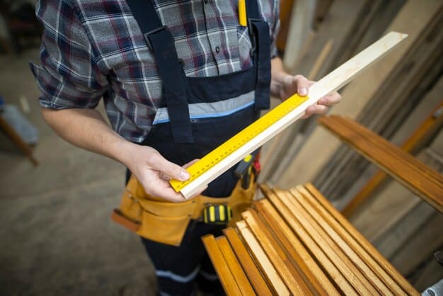 Carpenter measuring a plank in a woodworking workshop