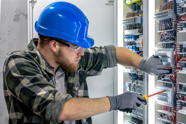 Electrician installing panel wiring — Second Act Trades