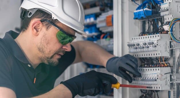 Electrician learning switchboard installation — Second Act Trades