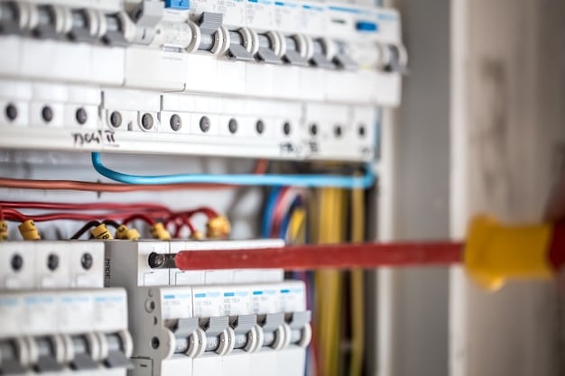 Electrician working in an electrical panel
