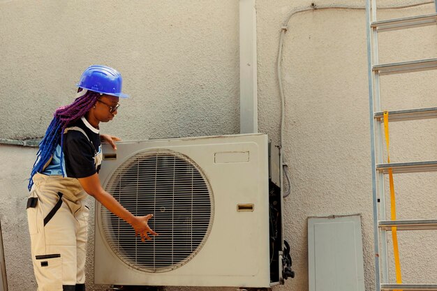 HVAC technician servicing an air conditioner — Second Act Trades