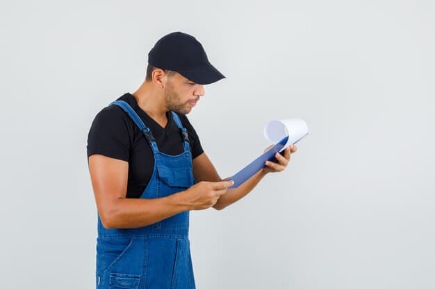 HVAC technician reviewing service work — Second Act Trades